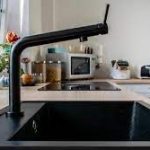 How can you enhance the overall appearance of your kitchen by replacing your old sink with a Black Sink Kitchen?
